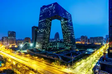 Beijing, China - April 1, 2024: Beijing central business district CBD skyline with the headquarters of Chinese television CCTV at night in Beijing, China.