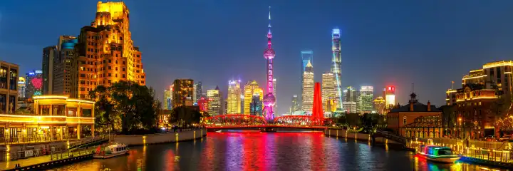 Shanghai, China - April 10, 2024: Shanghai skyline at the Bund with Oriental Pearl Tower downtown panorama at night in Shanghai, China.