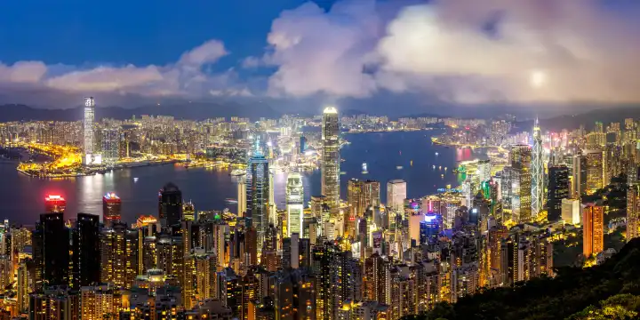 Hong Kong, China - April 4, 2024: Hong Kong skyline with skyscrapers downtown panorama at night in Hong Kong, China.