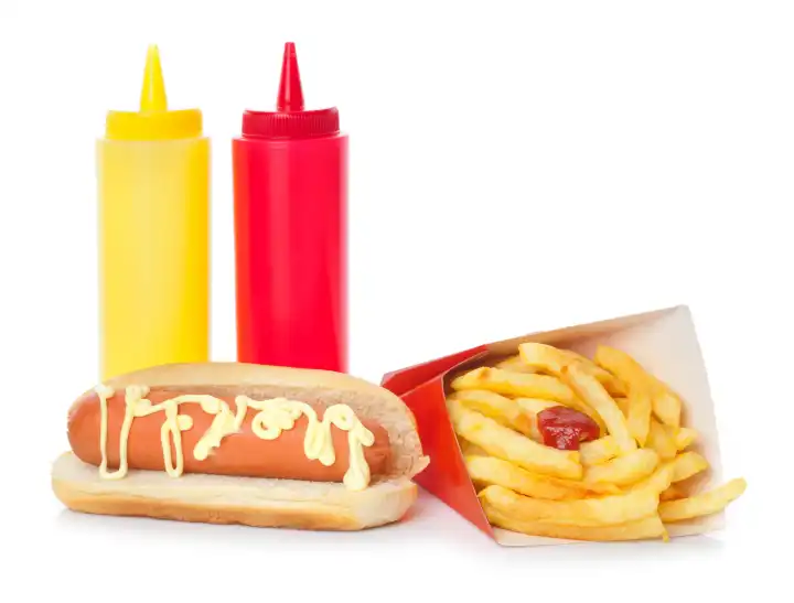 Fresh and tasty hot dog with fried potatoes on white