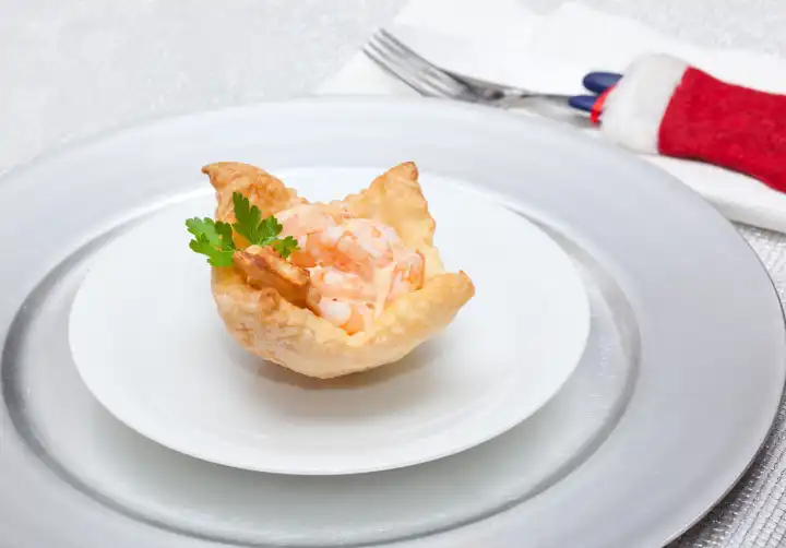 Shrimp cocktail in the puff pastry on christmas table