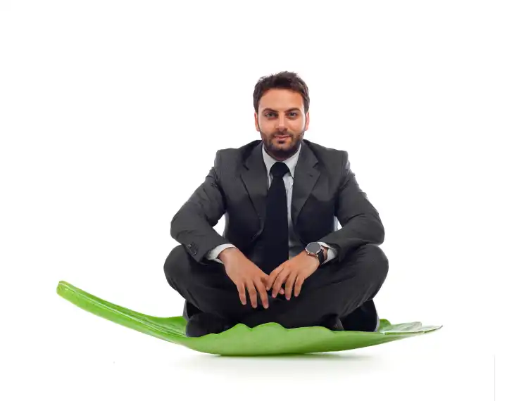 Businessmanlin the leaf on white background