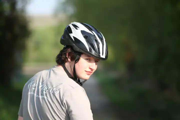 Boy, teenager riding a bicycle