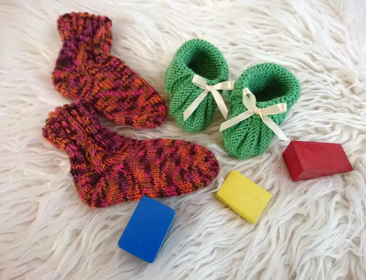 Baby equipment, socks, booties and building blocks