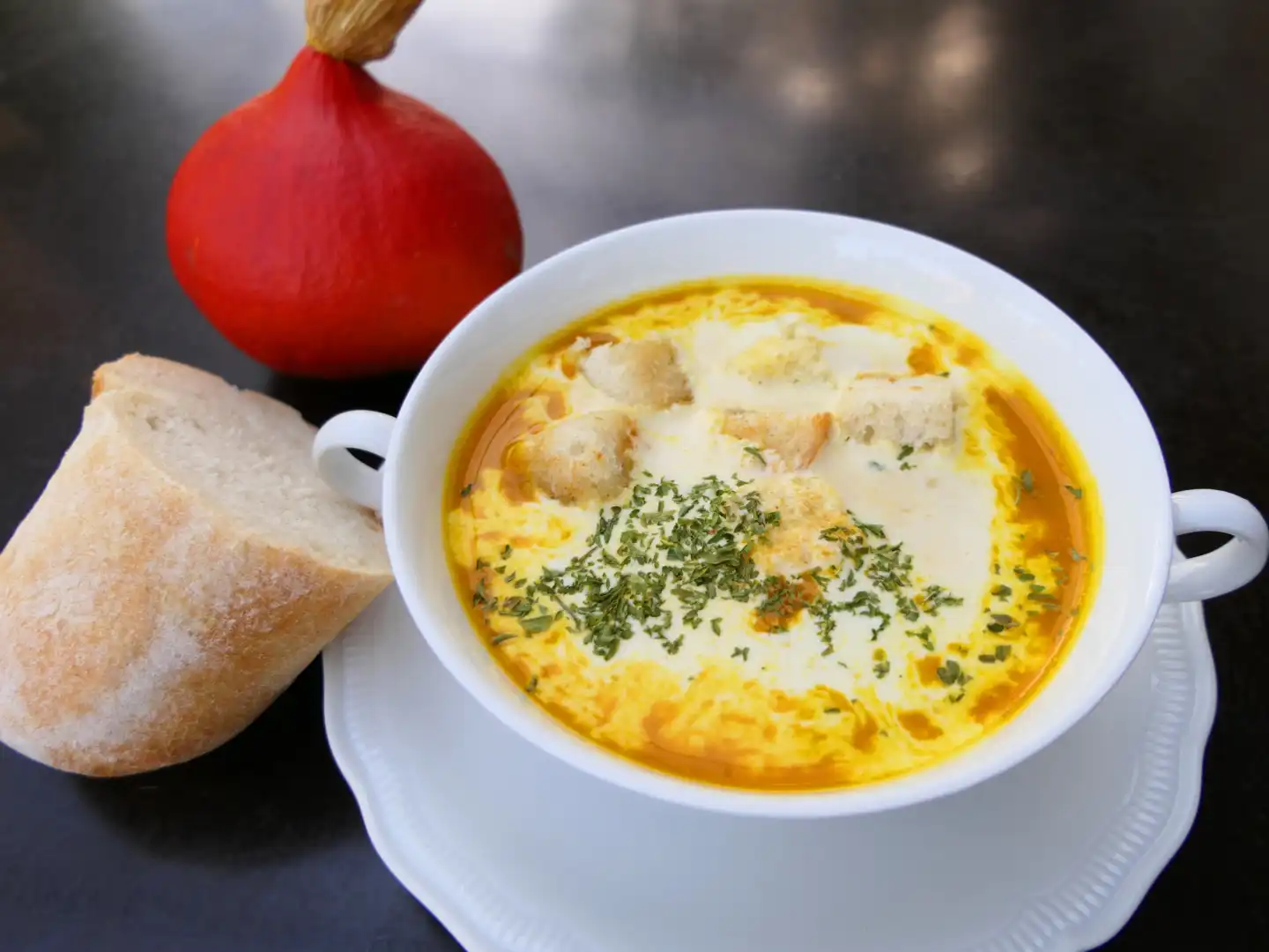 Cream of pumpkin soup from Hokkaido pumpkins, refined with cream and croutons, freshly prepared