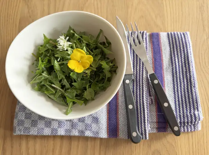 Wild herb salad with edible flowers