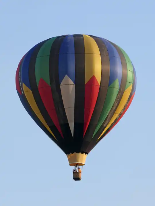 Hot air balloon ride under a bright blue sky