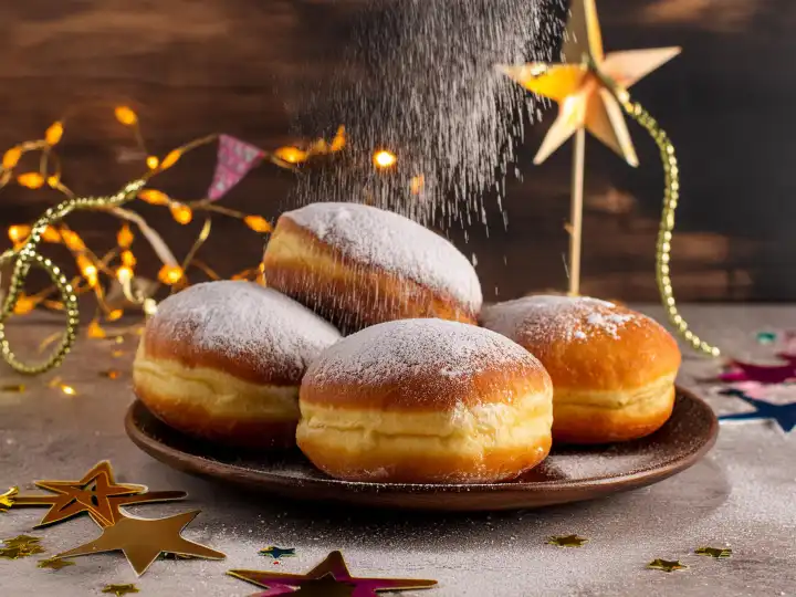 AI generated. New Year's Eve party with doughnuts on wood, trickling powdered sugar snow