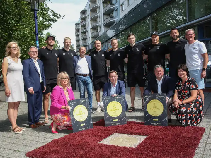 Guests of honor and SCM handball players at the inauguration of the ground plate for the 2023 EHF Champions League winner SC Magdeburg on Magdeburg Sports Walk Of Fame on 14.08.2023
