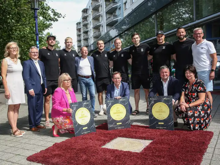 Guests of honor and SCM handball players at the inauguration of the ground plate for the 2023 EHF Champions League winner SC Magdeburg on Magdeburg Sports Walk Of Fame on 14.08.2023