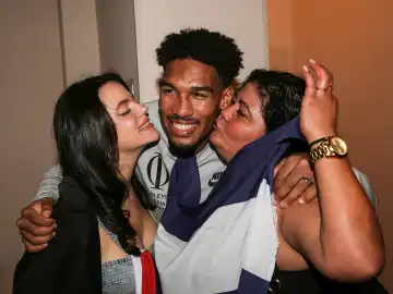 IBO super middleweight world champion Osleys Iglesias with pregnant wife Lucy and mother-in-law Deisy after winning world championship fight against Artur Reis at SES Boxing Gala on Oct. 7, 2023, in Magdeburg, Germany