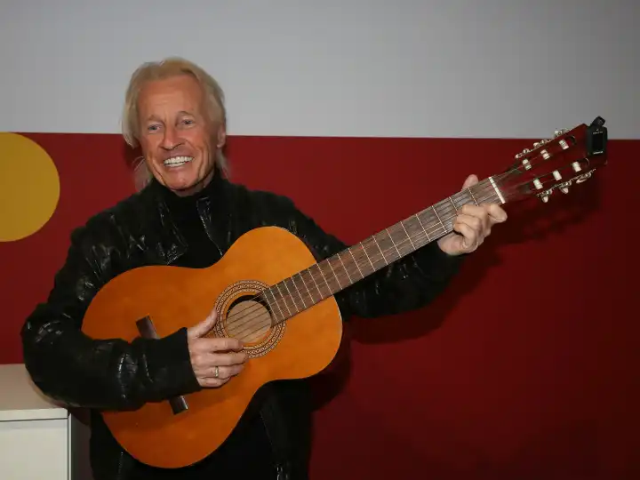 Pop singer and children's book author Christian Anders with guitar at the Leipzig Book Fair 2024 on 21.03.2024