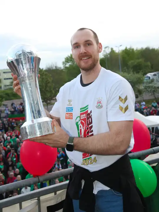 Norwegian handball player Christian O'Sullivan (SC Magdeburg ) with trophy at the reception of the current DHB Cup winner 2024 SC Magdeburg on 15.04.2024 at the GETEC Arena Magdeburg