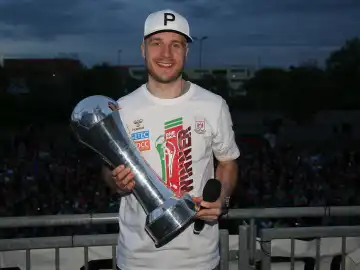 Swedish handball player Daniel Pettersson (SC Magdeburg) with trophy at the reception of the current DHB Cup winner 2024 SC Magdeburg on 15.04.2024 at the GETEC Arena Magdeburg