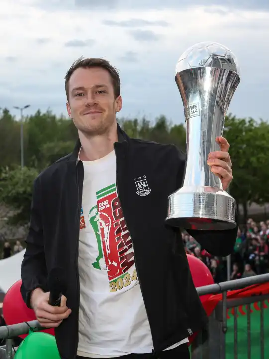 Swedish handball player Felix Claar (SC Magdeburg) with trophy at the reception of the current DHB Cup winner 2024 SC Magdeburg on 15.04.2024 at the GETEC Arena Magdeburg
