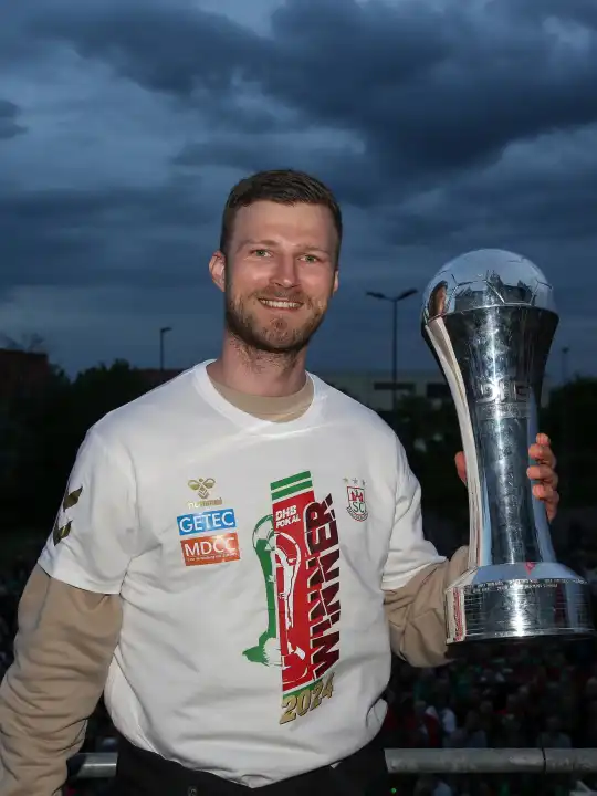 German handball player Philipp Weber (SC Magdeburg) with trophy at the reception of the current DHB Cup winner 2024 SC Magdeburg on 15.04.2024 at the GETEC Arena Magdeburg