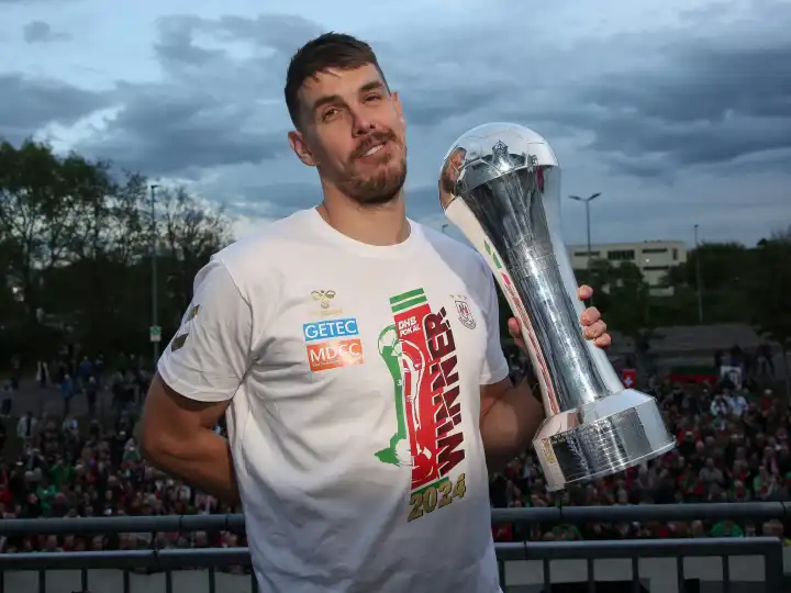 Polish handball player Piotr Chrapkowski (SC Magdeburg) with trophy at the reception of the current DHB Cup winner 2024 SC Magdeburg on 15.04.2024 at the GETEC Arena Magdeburg