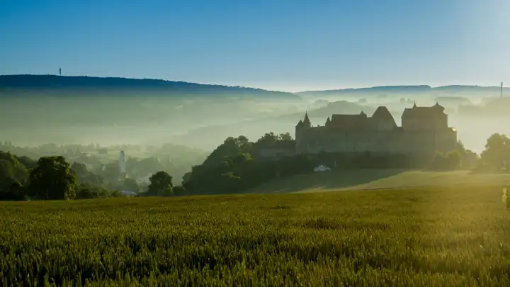 Harburg Castle in the morning sun with fog