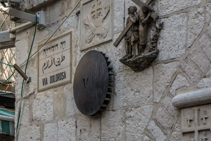 Fifth station of the Way of the Cross of Jesus on the Via Dolorosa in the Old City of Jerusalem in Israel. Thousands of pilgrims prayerfully and devoutly retrace the stations of Christ's Passion.