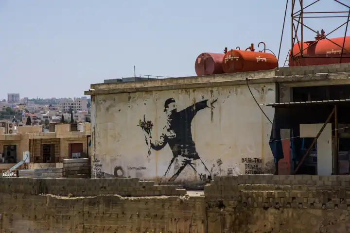 Banksy graffito in the West Bank, Israel.