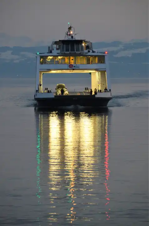 Illuminated ferry Friedrichshafen Romanshorn at sunset