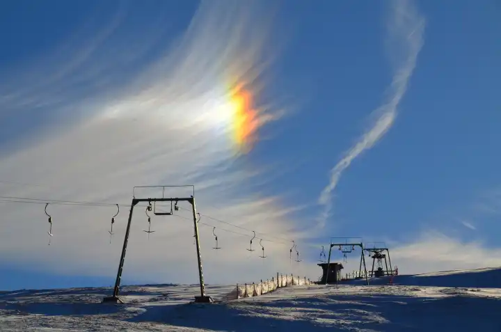 Rainbow over ski lift, Germany