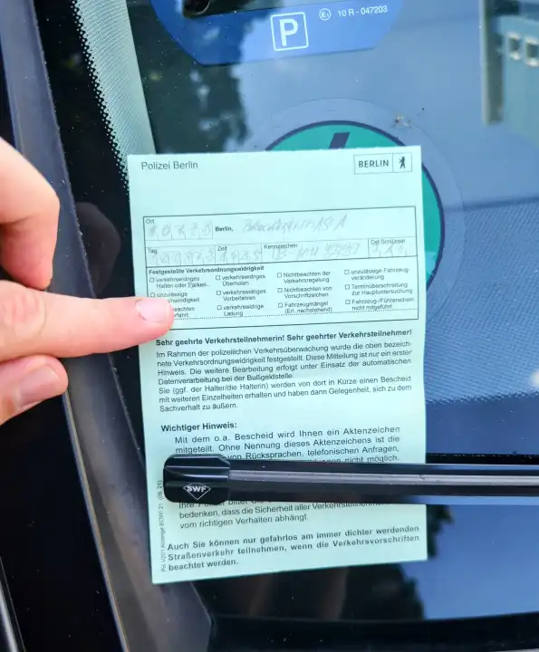 Berlin police ticket behind windshield wiper of car