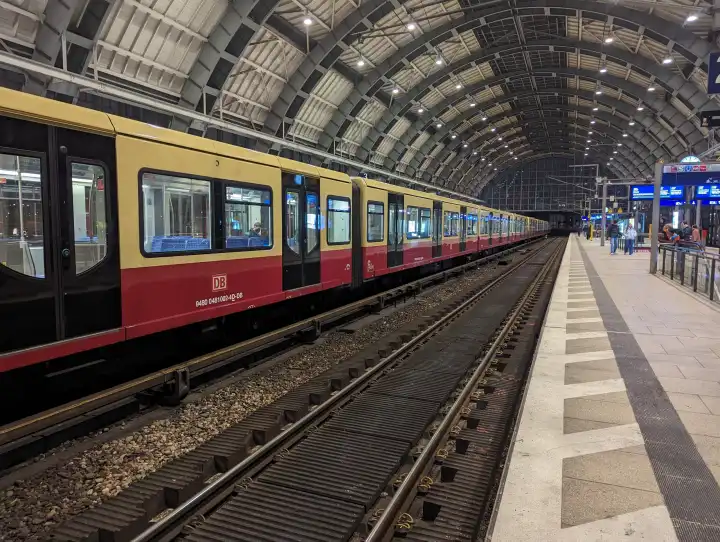 An S-Bahn of the Berlin S-Bahn Berlin GmbH of the line S5 direction Mahlsdorf in the train station Berlin - Alexanderplatz