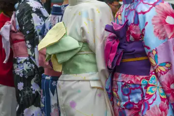 Japanese women wearing traditional Kimono walk on the streets of Kyoto, Japan