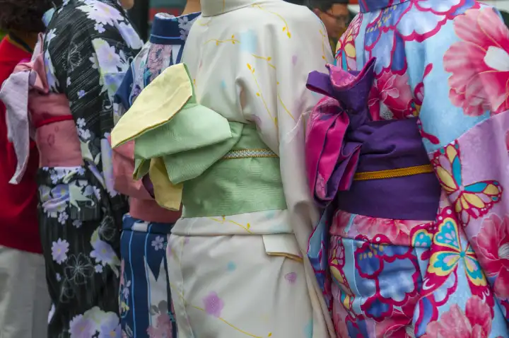Japanese women wearing traditional Kimono walk on the streets of Kyoto, Japan