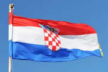 Croatian flag over the blue sky
