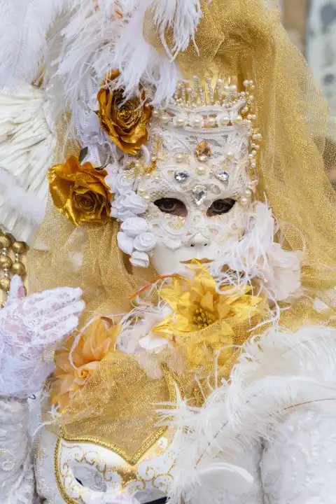 Traditional elaborate mask and costume at the annual Venice carnival. Italy, February 20, 2023.
