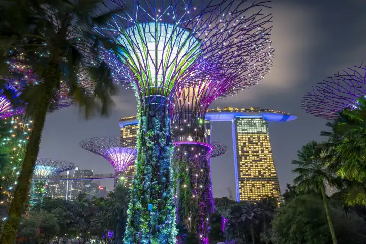 Singapore, Gardens by the Bay with the Super-Tress, in the background the Marina Bay Sands Hotel