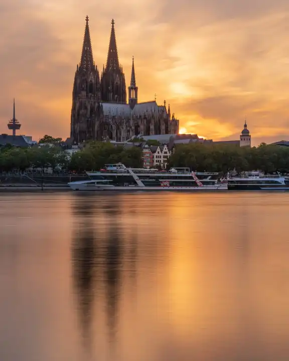 COLOGNE, GERMANY - JULY 10, 2023: Cathedral of Cologne against sunset on July 10, 2023 in Germany, Europe