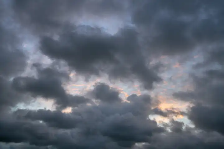 Low angle view to evening sky with dramatic clouds