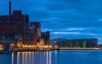 Duisburg; Germany - March 16; 2024: Panoramic image of historical city harbor of Duisburg during evening light on March 16; 2024 in Germany