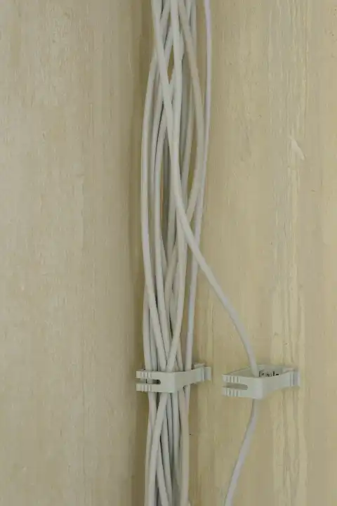 Many power cables on a wall, construction site, renovation of an apartment, North Rhine-Westphalia, Germany, Europe