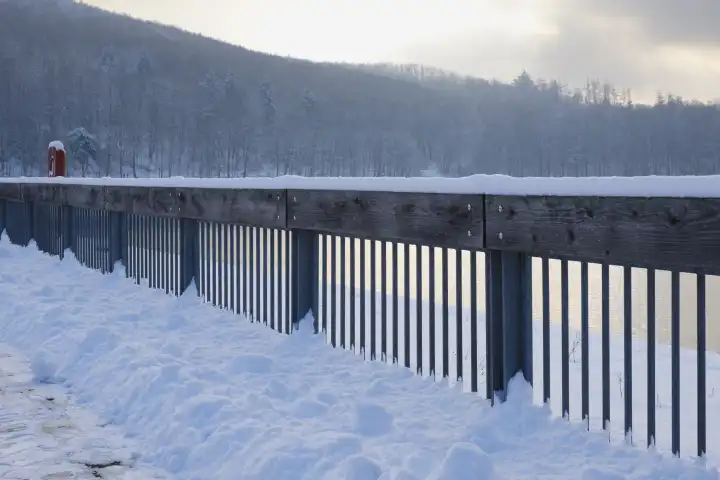 Fence with snow at the Hennesee, Meschede, Sauerland, North Rhine-Westphalia, Germany, Europe