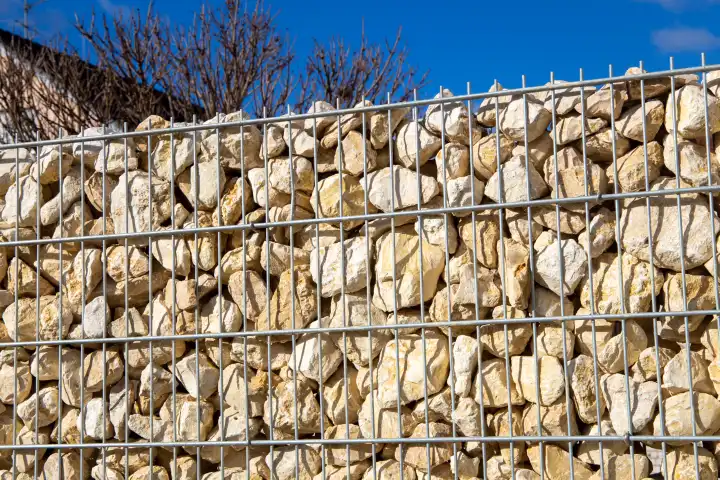 Close up of a gabion as a modern and high-quality visual protection and property boundary on a residential house