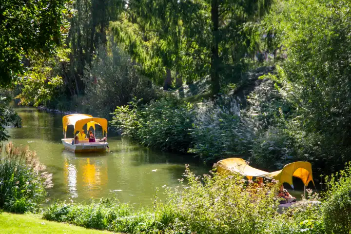 BUGA (Federal Horticultural Show) Mannheim 2023: Gondoletta boats sail through the Kutzerweiher pond in Luisenpark