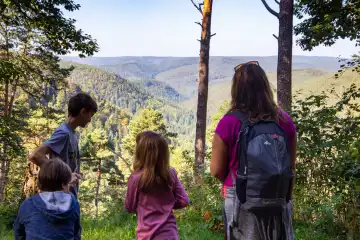 Family with children hiking in Palatinate Forest