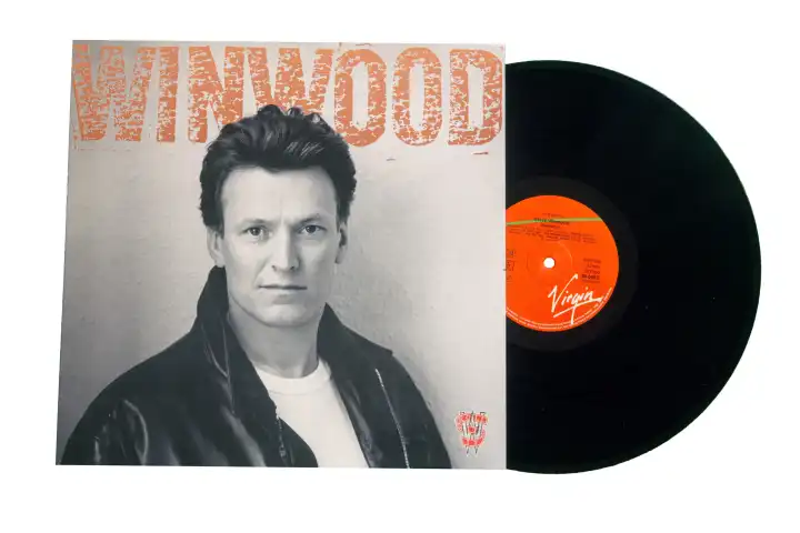 Cover of the album ROLL WITH IT by the English singer STEVE WINWOOD from 1988