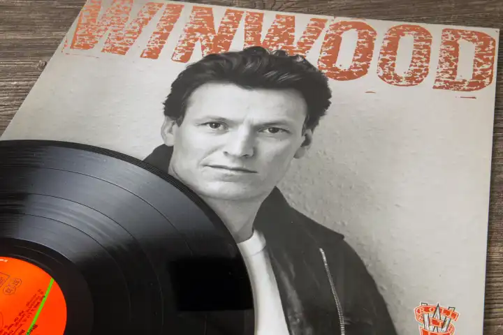 Cover of the album ROLL WITH IT by the English singer STEVE WINWOOD from 1988