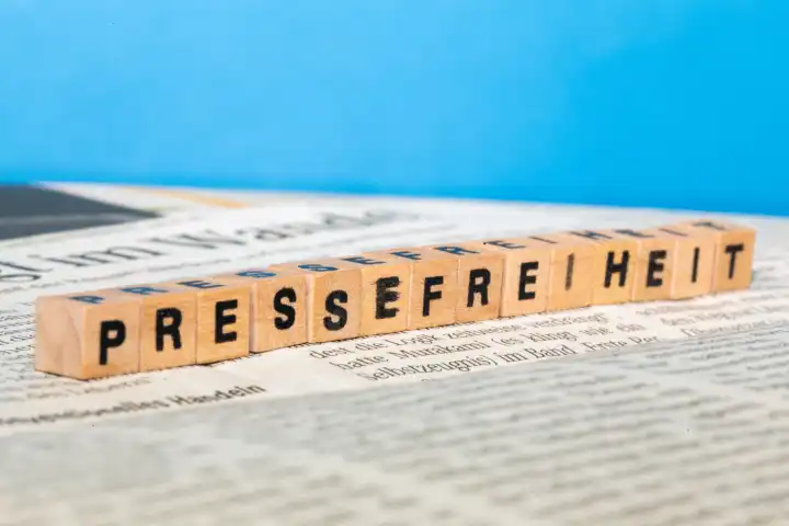 Press freedom icon image: Spelling on a newspaper

