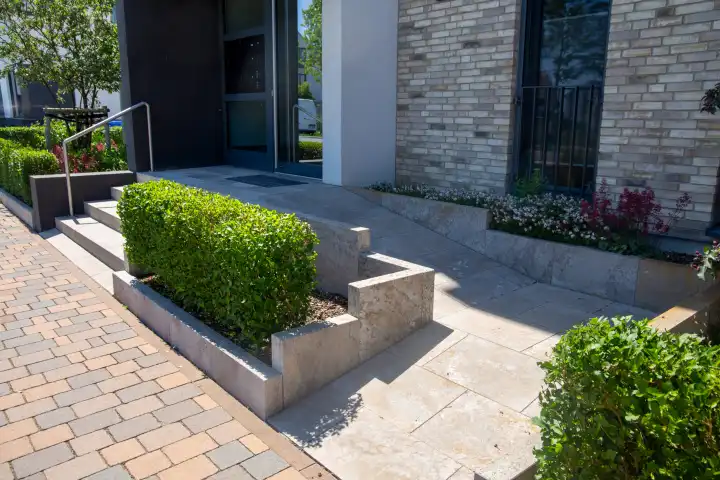 Residential building access with barrier-free wheelchair ramp