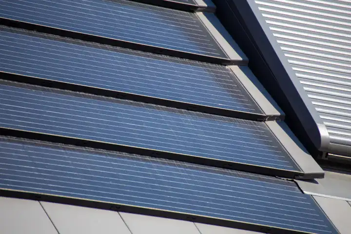 Close-up of a roof with photovoltaic tiles as an attractive alternative to conventional solar roofs