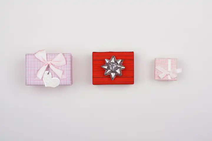 Three gifts on a white background.