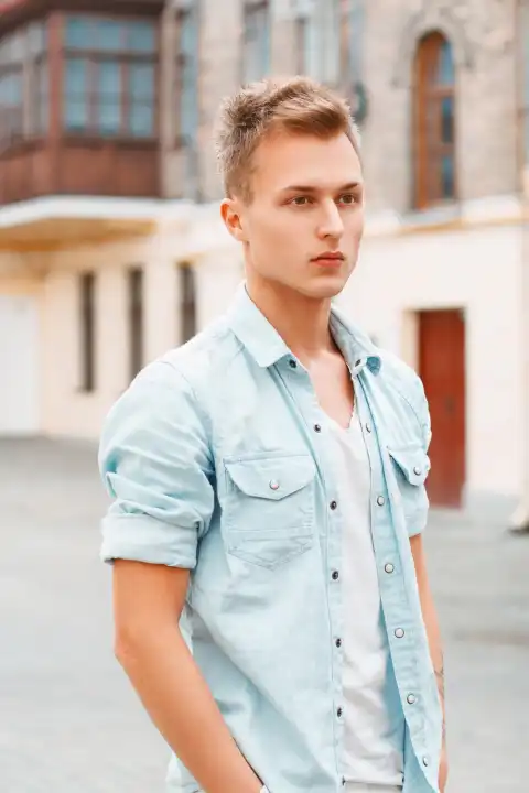 Young man in denim clothes outdoors