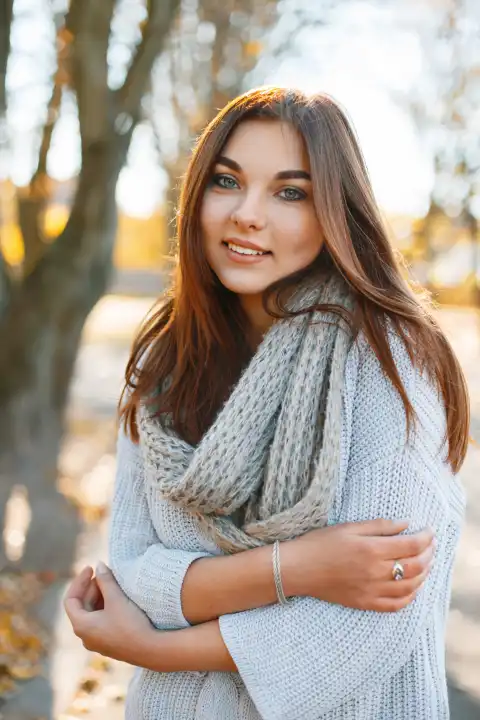 Beautiful young smiling brunette woman - colorful autumn portrait