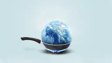 Planet Erde brennt in einer Bratpfanne auf einem Gasbrenner auf einem blauen Hintergrund, Konzept. Globale Erwärmung und Klimawandel, kreative Idee. Rettet den Planeten Erde
